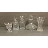 A selection of cut glass items to include decanters and vases