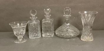 A selection of cut glass items to include decanters and vases