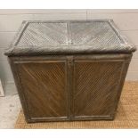 A grey painted cane storage box (H58cm W64cm D46cm)