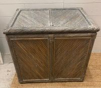 A grey painted cane storage box (H58cm W64cm D46cm)