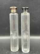 Two glass perfume bottles, one with a hallmarked silver top