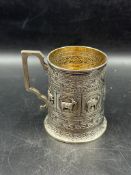 A Victorian silver tankard with animal decoration (Approximate Height 9cm) suppied by Marshall &