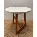 A white topped contemporary side table by Hamar (H50cm Dia50cm)