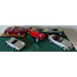 Five model sports cars including Ferrari, Porsche etc