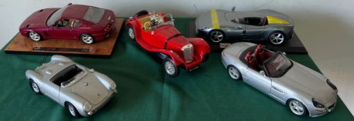 Five model sports cars including Ferrari, Porsche etc