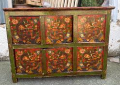 An oriental style two cupboard sideboard consisting of six hand painted panels depicting dragons and