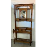 An Arts and Crafts hall stand with central mirror, barely twist supports (W 100cm x D 33cm x H