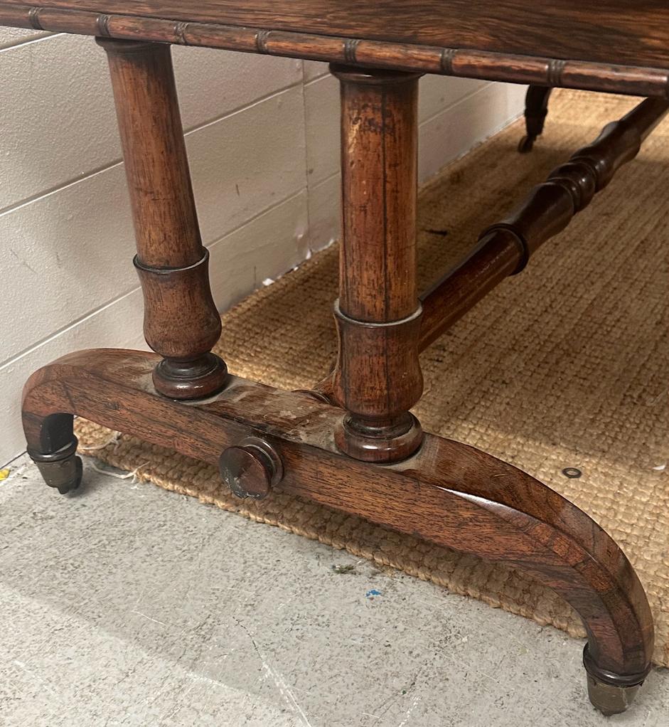 A substantial coffee table on down swept legs on castors with a turned cross stretcher AF H49cm - Image 2 of 5