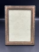 A single silver picture frame 21cm x 16cm on an easel back