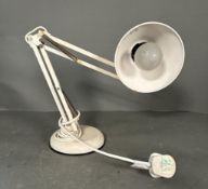 A white Mid Century anglepoise lamp