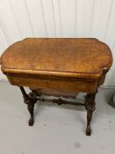 A Victorian Burr Walnut Games Table. The table top opens to reveal Chess, back gammon and cribbage