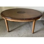 An oval side table with inlaid top on tapering legs by Brights of Nettle bed