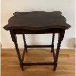 A mahogany side table on barley twist legs (60cm x 40cm x 73cm)