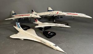 Concorde interest: A selection of five model Concorde planes on mounts various conditions.