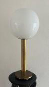 A 1970's brass and opaque glass ball lamp 80cm H