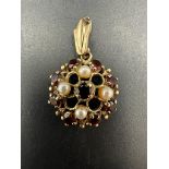 A 9ct gold pearl and garnet pendant