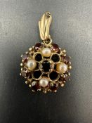 A 9ct gold pearl and garnet pendant
