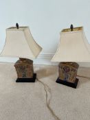 A pair of ceramic lamps on wooden bases