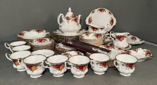 A Royal Albert tea/dinner service in "The Old Country Rose" pattern. To include cups, saucers, tea