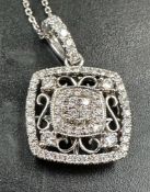 18 carat white gold diamond set pendant marked on the bale D0.358 18K 750 suspended on a 9 carat