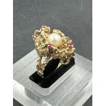 A 9ct gold coral style contemporary ring with pearl and rubies (Approximate total weight 10.2g)