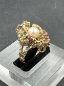 A 9ct gold coral style contemporary ring with pearl and rubies (Approximate total weight 10.2g)