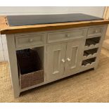 A white painted granite topped kitchen central island comprising of six drawers two central