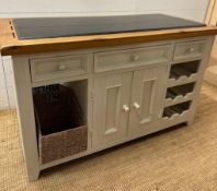 A white painted granite topped kitchen central island comprising of six drawers two central