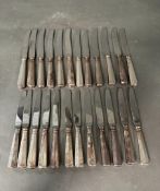 A set of Swiss silver handled knives and butter knives, twelve of each hallmark to handle