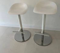 Two kitchen stools with moulded seats on chrome base