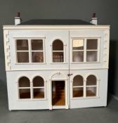 A wooden white painted dolls house with adjoining conservatory height 60 26x59