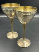 Two silver wine goblets on gilt textured stems, hallmarked for London 1978 Stuart Devlin (