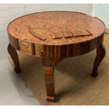 An Art Deco marquetry centre table with a variety of woods to include , maple, walnut, birds eye