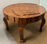 An Art Deco marquetry centre table with a variety of woods to include , maple, walnut, birds eye