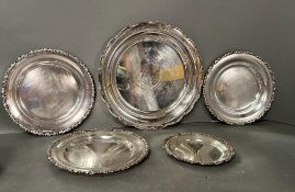 A selection of five Egyptian silver platters various sizes the largest diameter 34cm (Approximate