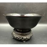 A 19th Century Chinese black glazed bowl on stand