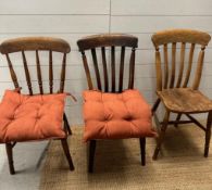 A selection of three farmhouse kitchen chairs, one spindle back and two slat back
