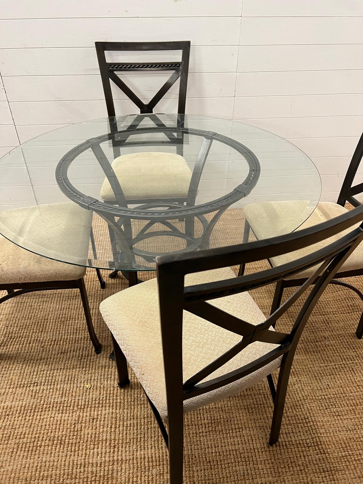 A contemporary glass and metal dining table with four chairs (H75cm Dia114cm) - Image 3 of 5