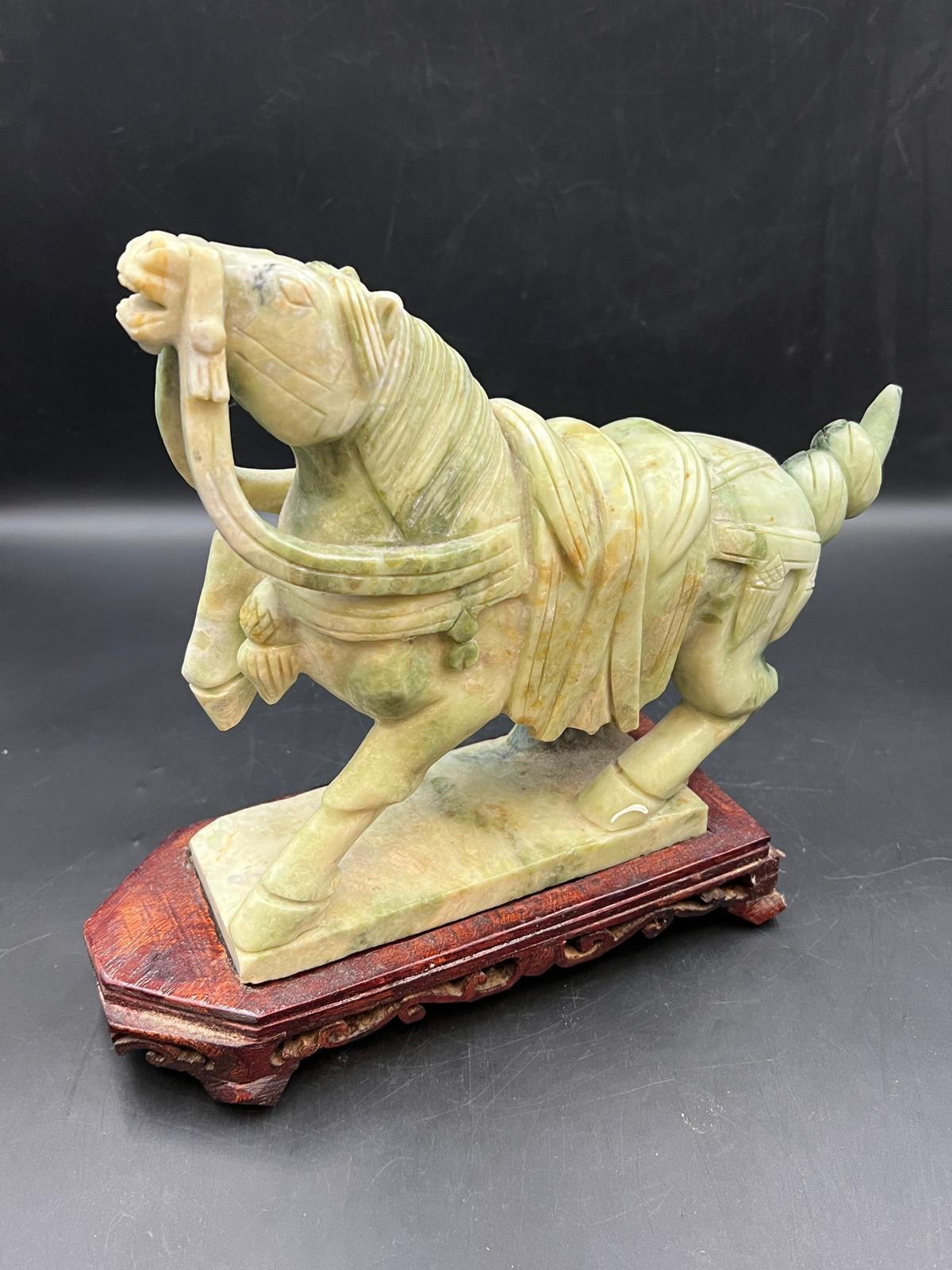 A marbled stone sculpture of a Thai horse on base (H25cm W25cm)