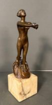 An Art Deco bronze nude of a lady emerging on a marble plinths (H33cm)