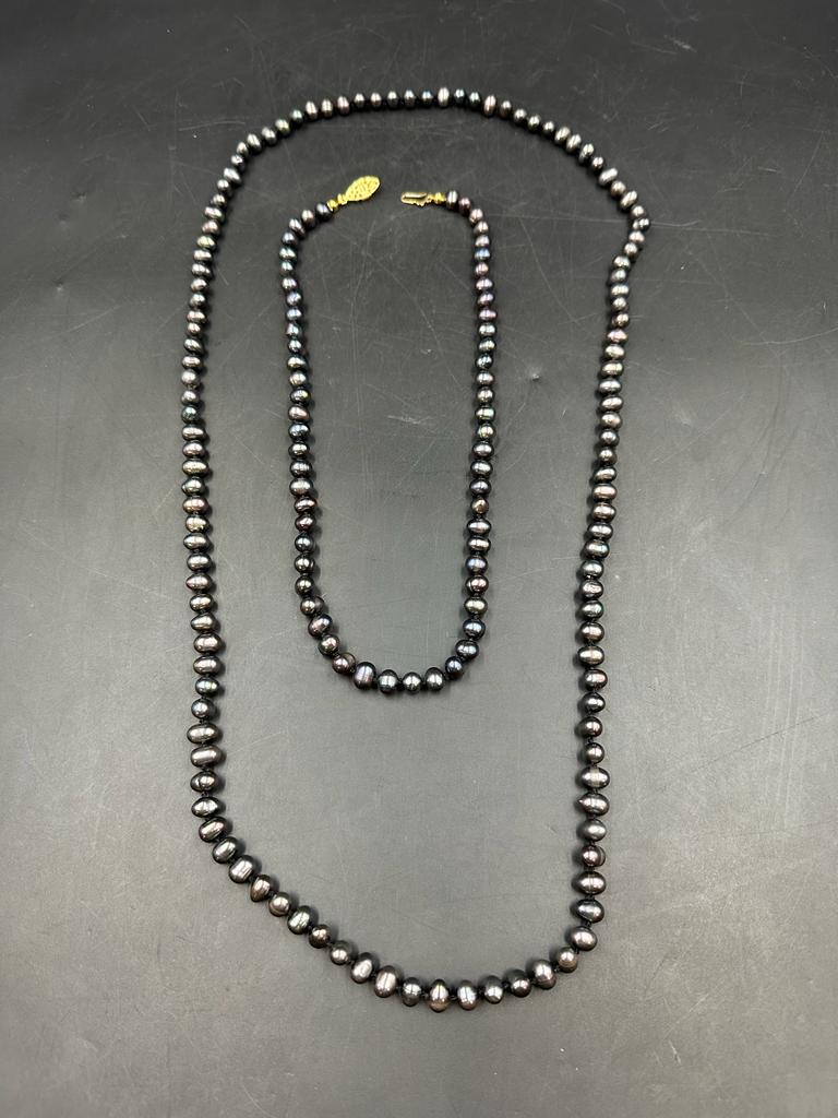 Two black pearl necklaces