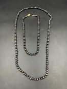 Two black pearl necklaces