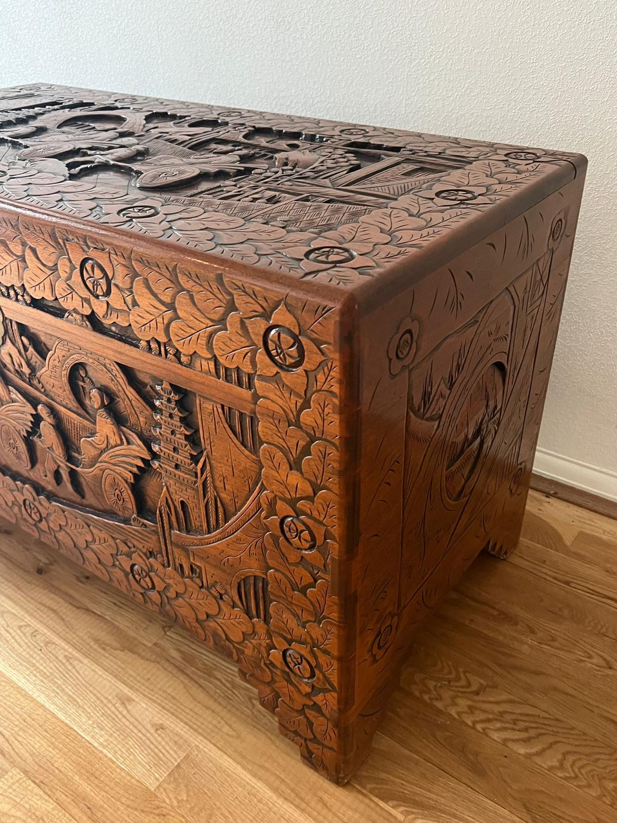 An ornately carved camphor wood chest (H 60cm x D 50cm x W 102cm) - Image 10 of 11