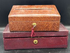 Two leather and Crocodile jewellery boxes. One fitted with a tray