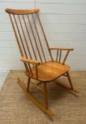 A Mid Century teak Windsor stick back rocking chair