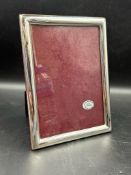 A single 20cm x 15cm silver photograph frame with easel back