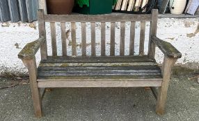 A wooden two seater reclaimed garden bench (H90cm W133cm D62cm)