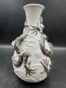 A Lladro china Chinese style Dragon vase decorated with silver chasing Dragons on white bisque