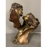 A bronze sculpture of a man and a women embracing titled "Desire" (H38cm)