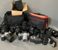 A selection of various cameras,camera bags, lenses to include Fujifilm, Leica, and Olympus.